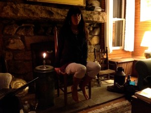 Suzanne last September, leading a workshop reading at the Pond House retreat in front of the fieldstone fireplace. 